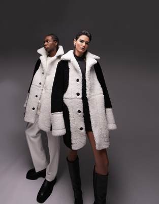 TSTM Unisex Premium Limited Edition colour block shearling coat in black - ASOS Price Checker