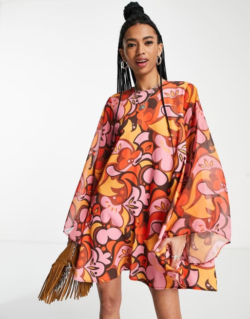 Twisted Wunder - Retro mini swingjurk met klokmouwen en boho-print
