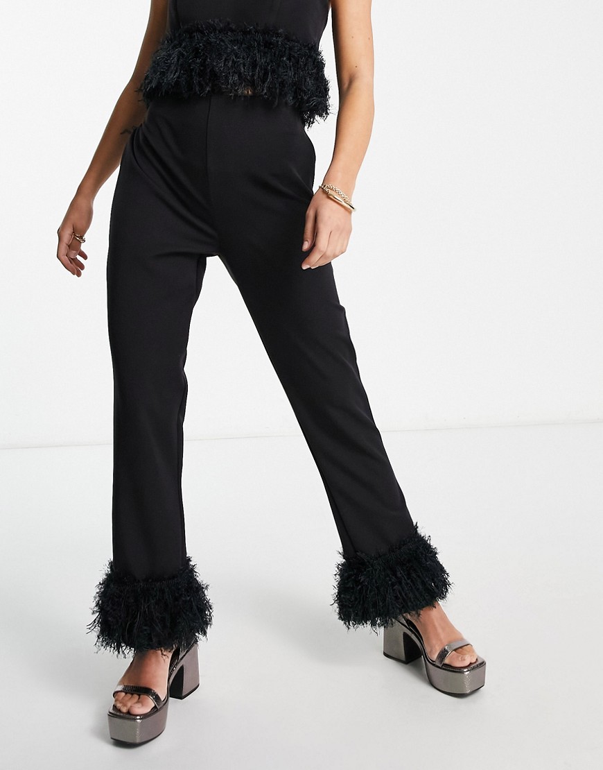 straight leg pants with faux feather hem in black - part of a set
