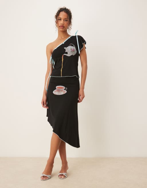 Tyler McGillivary alice tea motif ribbon top in black - part of a