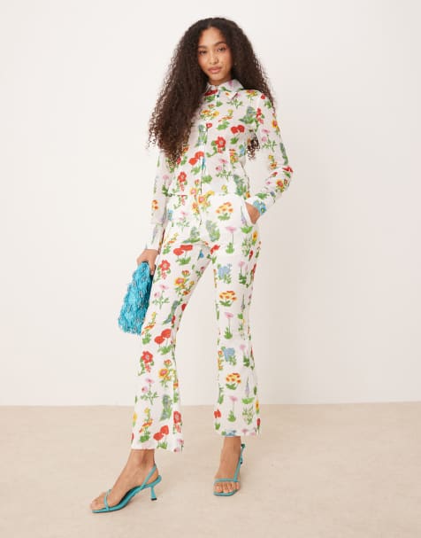 Tyler Mcgillivary uma flower print flared trousers in white