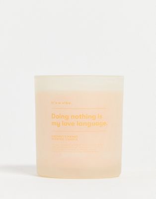 Typo candle with 'love language' slogan in coconut and mango scent