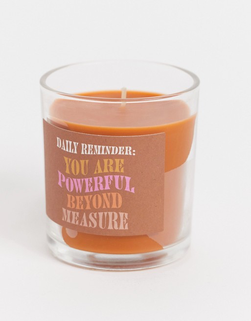 Typo candle with powerful slogan