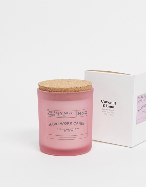 Typo candle with slogan 'hard work candle' in pink