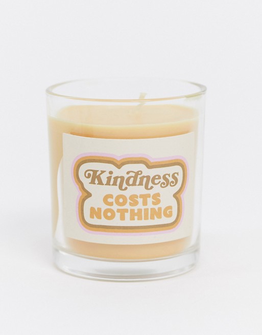 Typo candle with slogan 'kindness costs nothing'