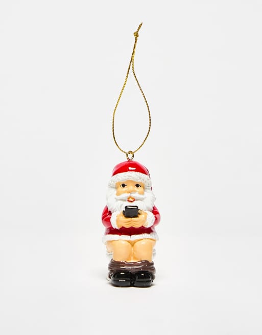 Typo - Décoration de Noël avec Père Noël utilisant un téléphone au toilette