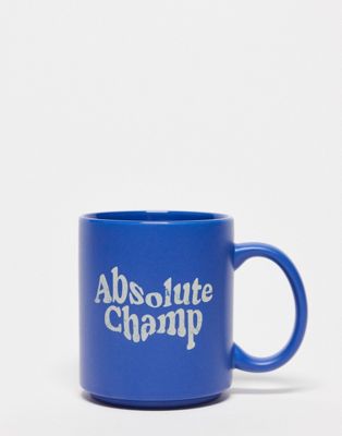 Typo mug with 'absolute champ' slogan in blue