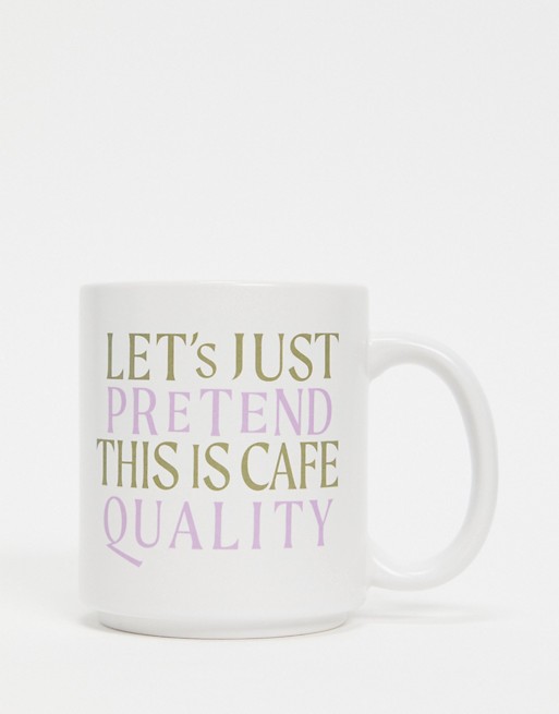 Typo mug with slogan 'let's pretend this is café quality'