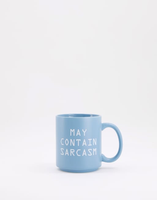 Typo mug with slogan 'may contain sarcasm'