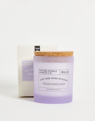 Typo 'one more episode' slogan candle with pepperwood scent in lilac