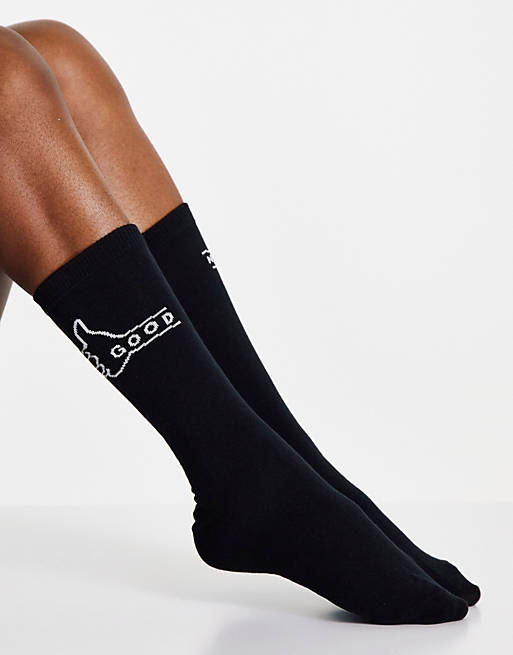 Typo socks in black with thumbs up and down motif
