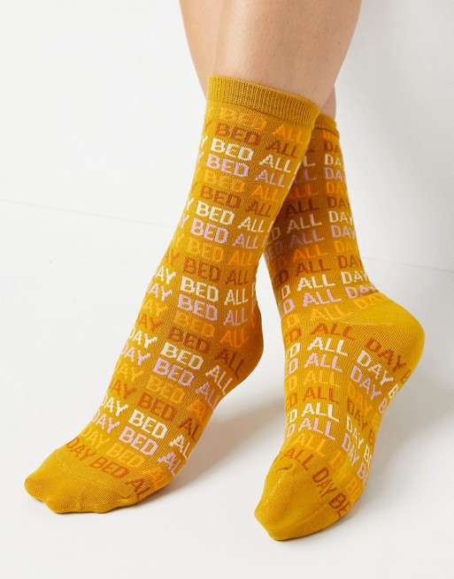 Typo socks with slogan 'bed all day'