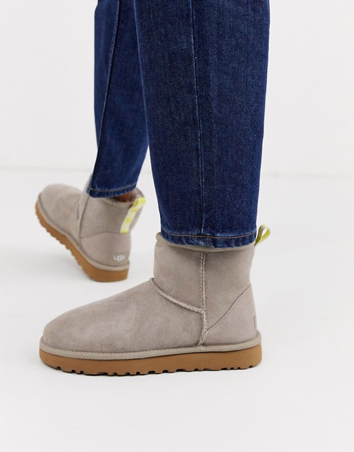 UGG Classic Mini II Graphic Logo ankle boots in oyster and yellow