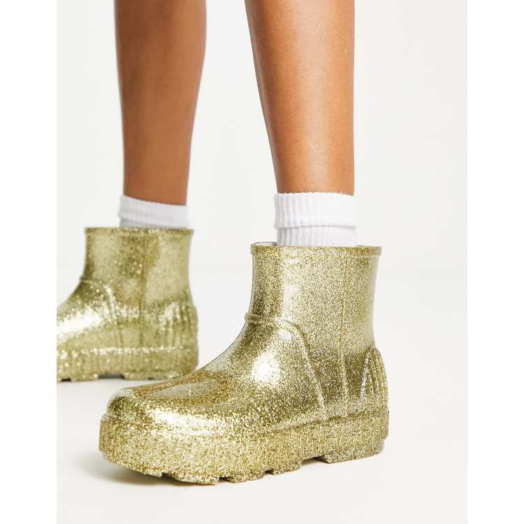 UGG Drizlita Bottes en caoutchouc scintillantes Dor ASOS