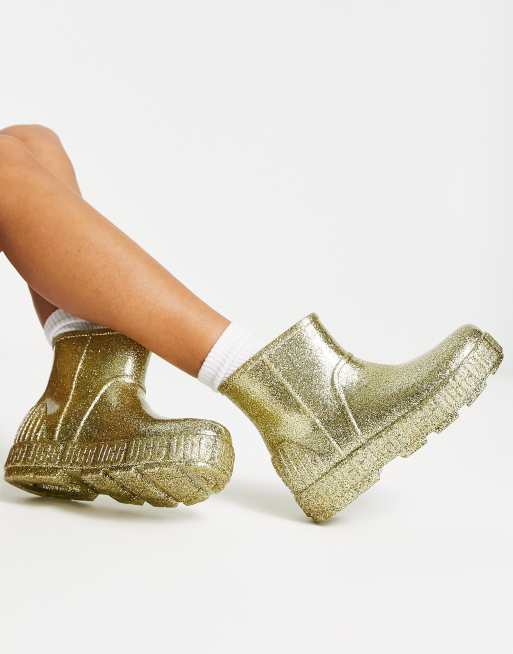 UGG – Drizlita – Guldfärgade glittriga gummistövlar, 2 av 4