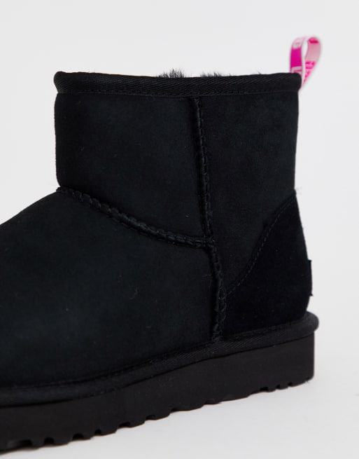 UGG Mini classic boot with neon logo taping in black and pink