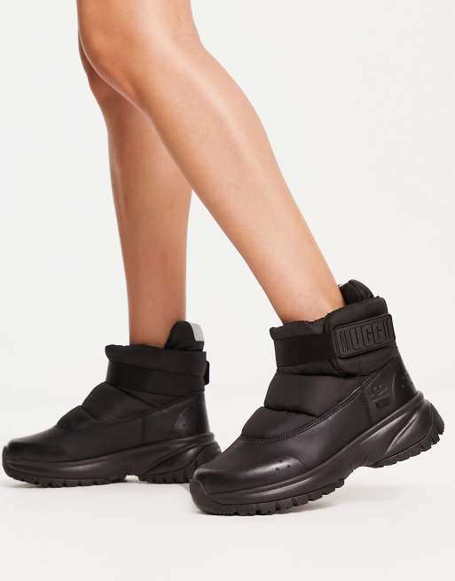 UGG Yose Puff boots in black ASOS