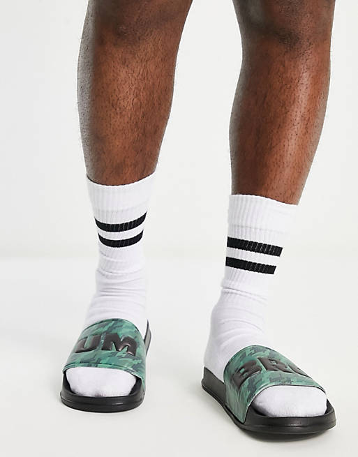 Umbro graphic sliders in green and black camo | ASOS