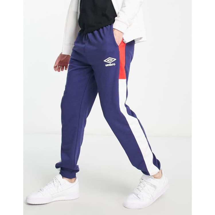 Umbro Home Turf panelled joggers in navy and red ASOS