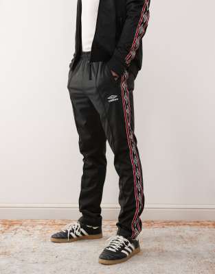 Umbro Umbro taped track pant in black