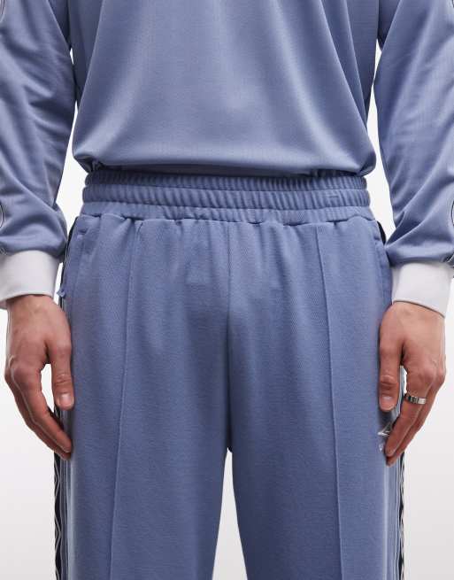 Umbro taped track pants in blue, 4 of 5