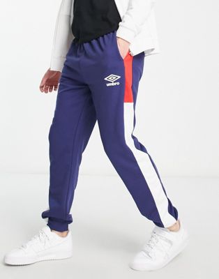 Umbro Home Turf panelled joggers in navy and red