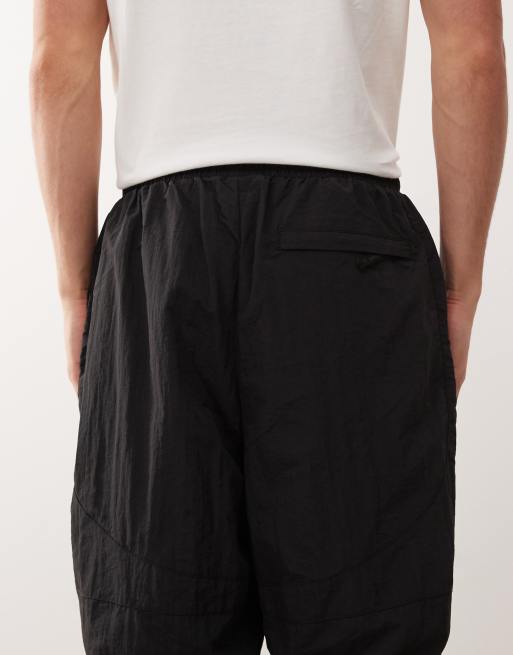 Umbro zip off loose fit sweatpants in black | ASOS