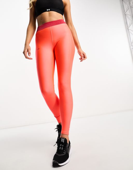 Under Armour branded legging in neon orange