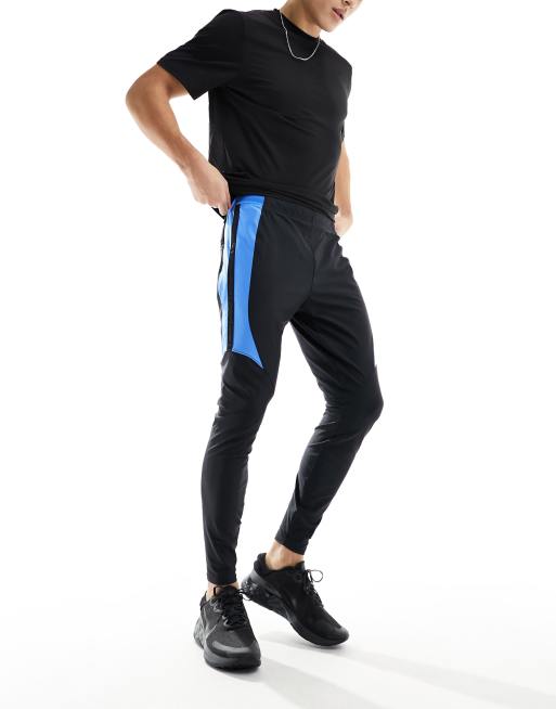 Under Armour Challenger Pro joggers in black and blue