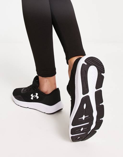 Under Armour Charged Pursuit 3 trainers in black and white