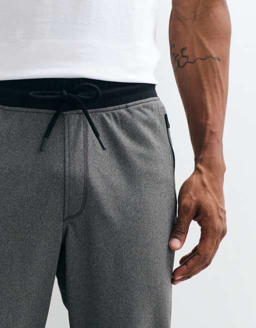 Under Armour – Grafitowe sportowe joggersy trykotowe, 5 z 5