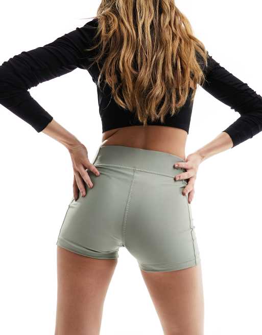 Under Armour mid rise booty shorts in khaki