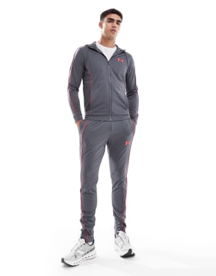 Under Armour Under Armour Novelty tracksuit in castlerock grey and racer red