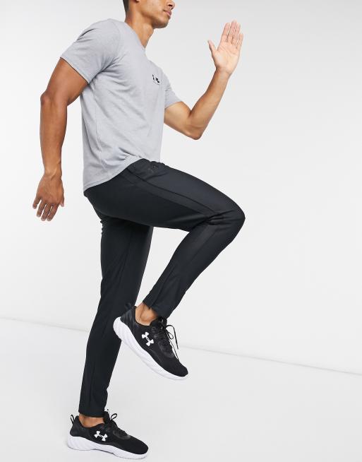 Under Armour sportstyle pique track pants in black