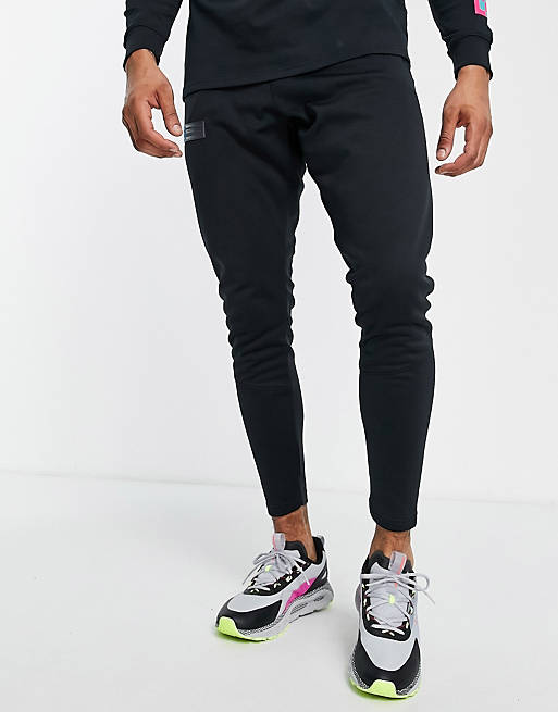 Under Armour storm joggers in black and blue