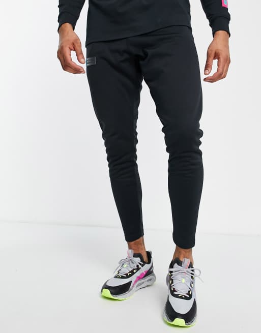 Under Armour storm trackies in black and blue