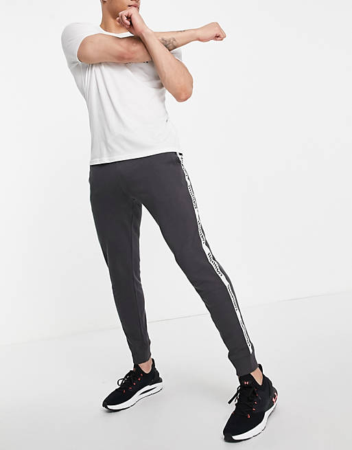 Under Armour Training Rival terry logo tape joggers in grey