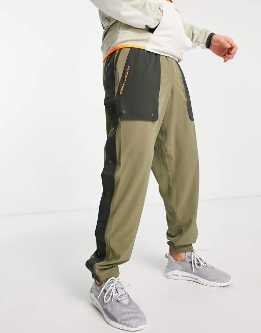 Under Armour – Training Rush – Gewebte Hose in Khaki mit Tasche