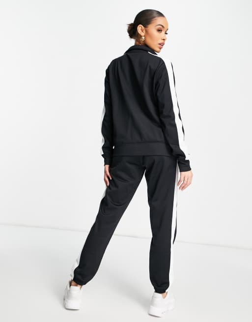 Under Armour Training tricot tracksuit set in black and white ASOS