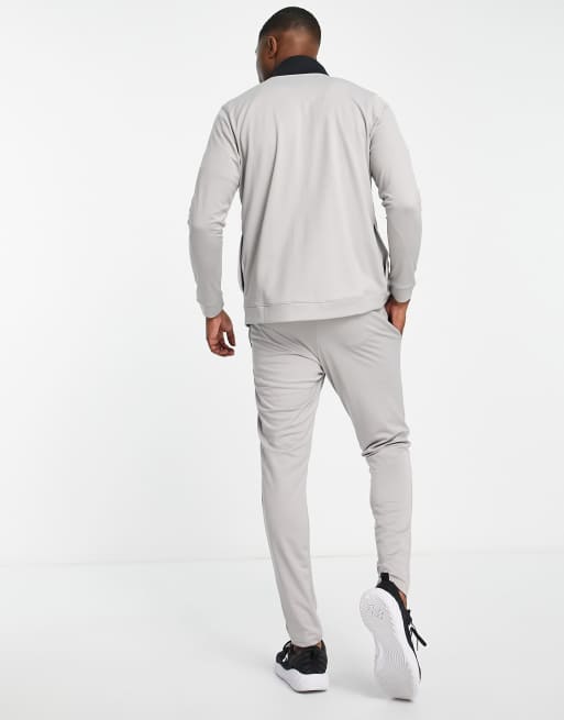 Under Armour Tuta sportiva grigia colorblock da calcio ASOS