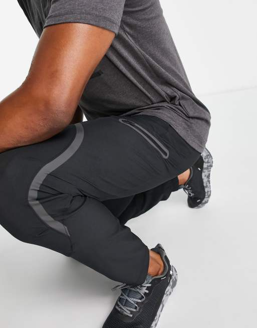 Under Armour Unstoppable cargo joggers in black