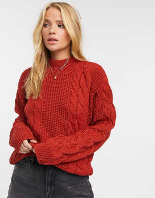 red chunky cable knit sweater
