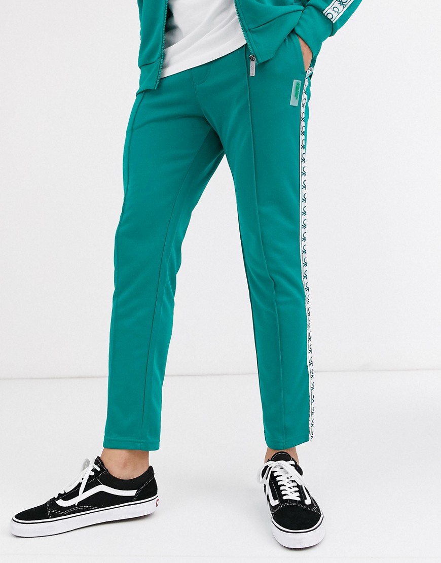 United Colors Of Benetton - Pantaloni della tuta sportiva con fettuccia con logo verdi-Verde