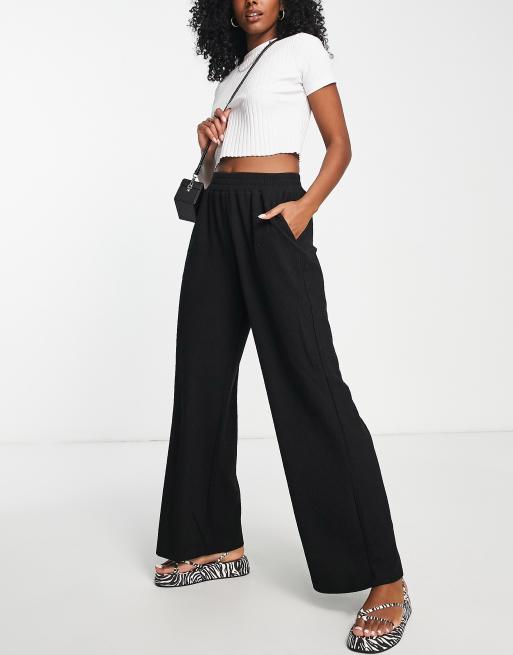 Urban Revivo flare pants in black | ASOS