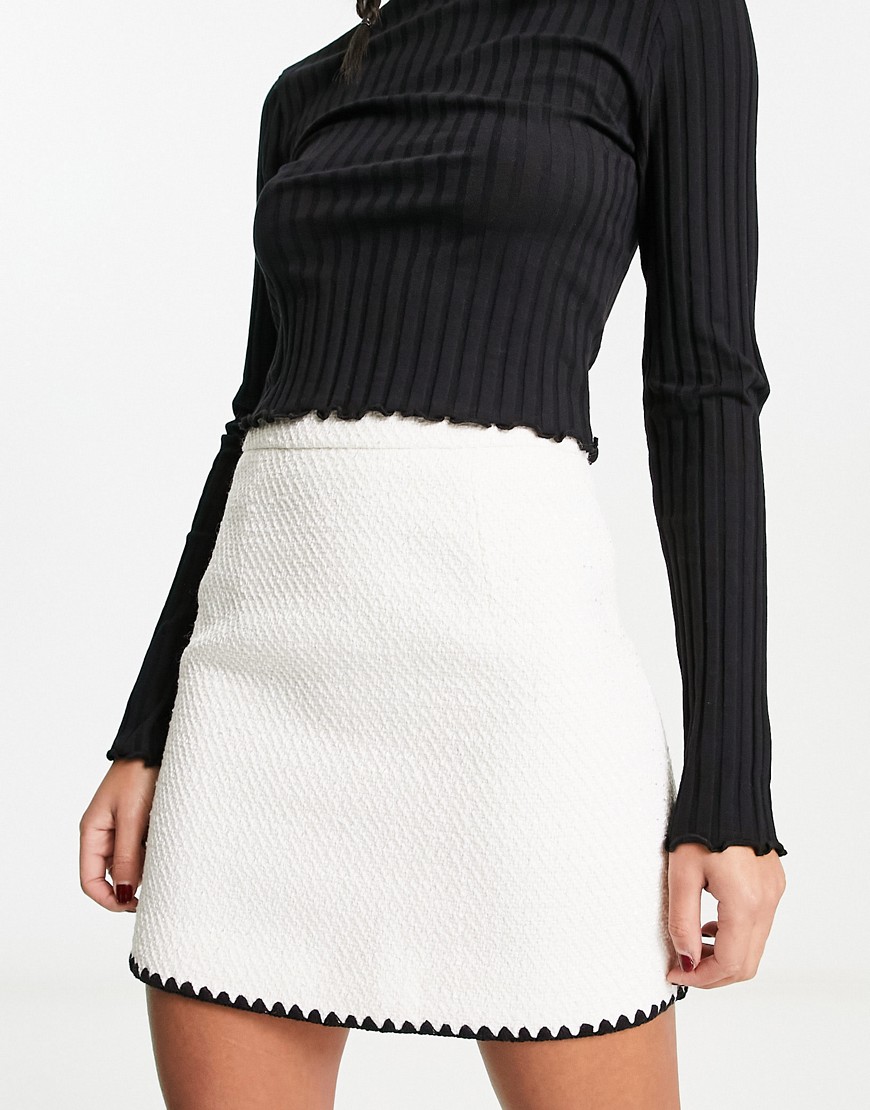 Urban Revivo knitted mini skirt with cut out edges in white