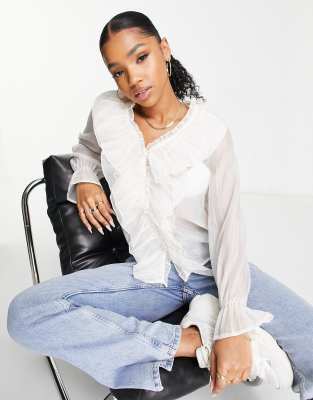 Ruffle Blouses That Add A Touch Of Romance 2025 / 2026 » Fashion Allure