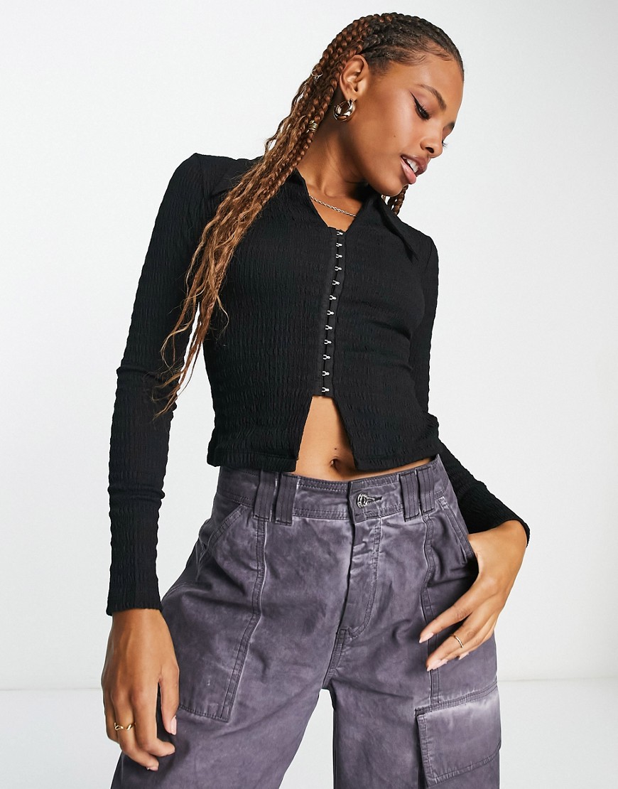 textured eyelet polo top in black