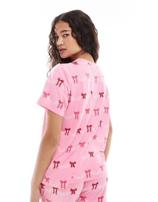 Urban Threads Christmas short sleeve revere and trouser pyjama set in festive bow print, 3 of 4