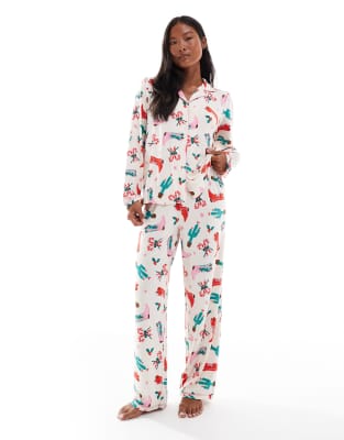 Urban Threads Urban Threads Petite Christmas long sleeve revere and trouser pyjama set in cowboy print-Multi