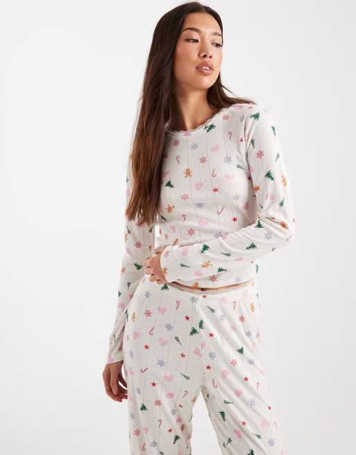 Urban Threads - Top del pigiama natalizio traforato a maniche lunghe color crema